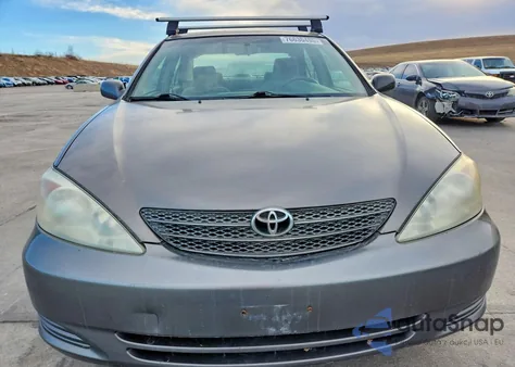 2003 Toyota Camry Le z USA, uszkodzony, nr VIN 4T1BE32KX3U765834